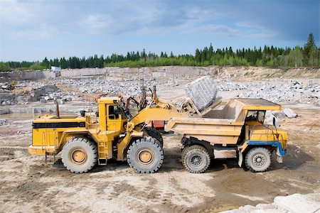 Excavation and dump vehicle in a granite quarry Photographie de stock - Aubaine LD & Abonnement, Code: 400-06085264