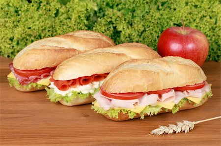 simsearch:400-05311244,k - Fresh sandwiches with ham, salami and smoked salmon Foto de stock - Super Valor sin royalties y Suscripción, Código: 400-06086465