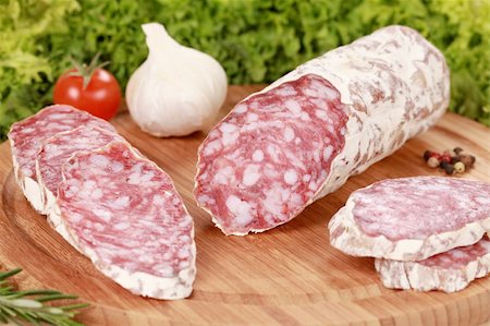 Original Salami from Italy served with garlic and tomatoes Stock Photo - Budget Royalty-Free & Subscription, Code: 400-06086481