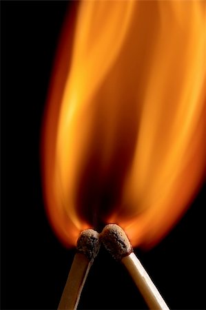 Two burning match on black background Stock Photo - Budget Royalty-Free & Subscription, Code: 400-06088028