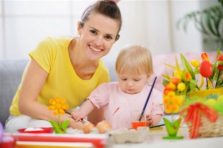 Happy mother helping baby painting on Easter eggs Stock Photo - Budget Royalty-Free & Subscription, Code: 400-06083063