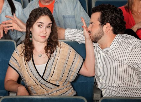 Irritated girlfriend stops misbehaving boyfriend in theater Stock Photo - Budget Royalty-Free & Subscription, Code: 400-06083898