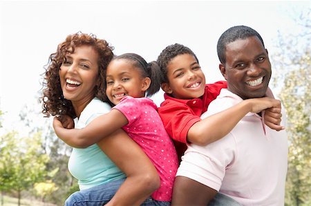 Portrait of Happy Family In Park Stock Photo - Budget Royalty-Free & Subscription, Code: 400-06095654