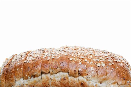 The top of a loaf of whole grain sliced bread.  Shot on white background. Stock Photo - Budget Royalty-Free & Subscription, Code: 400-06097168