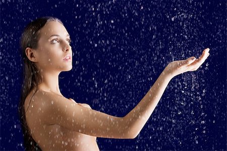 spa water background pictures - beauty classic portrait of beautiful girl with water on the skin and wet hair over dark background, she is turned at left, looks up and her right  arm are raised Stock Photo - Budget Royalty-Free & Subscription, Code: 400-06097321