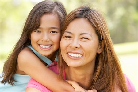 filipina mother daughter - Mother And Daughter Enjoying Day In Park Photographie de stock - Aubaine LD & Abonnement, Code: 400-06097512