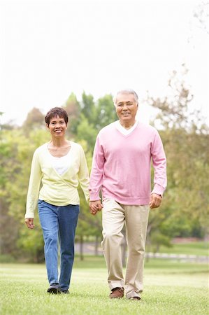 simsearch:400-04035087,k - Senior Couple Walking In Park Stock Photo - Budget Royalty-Free & Subscription, Code: 400-06097606