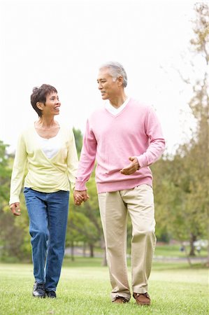 simsearch:400-04035087,k - Senior Couple Walking In Park Stock Photo - Budget Royalty-Free & Subscription, Code: 400-06097607