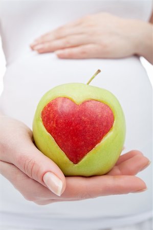 Healthy nutrition during pregnancy concept with apple heart Foto de stock - Super Valor sin royalties y Suscripción, Código: 400-06098823