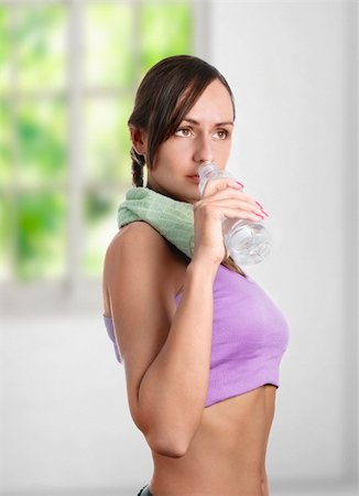 simsearch:400-04969467,k - Beautiful sporty woman drinking water and doing sport Photographie de stock - Aubaine LD & Abonnement, Code: 400-06098928