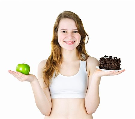 simsearch:400-05106591,k - Smiling young woman holding apple and chocolate cake Stock Photo - Budget Royalty-Free & Subscription, Code: 400-06092359