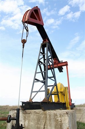 simsearch:400-04317986,k - Oil pump jack working in the field Stock Photo - Budget Royalty-Free & Subscription, Code: 400-06092511