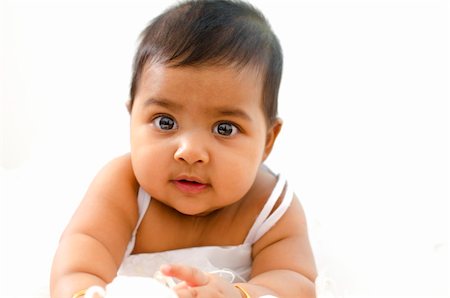 simsearch:400-05153083,k - Adorable 6 months old Indian baby girl looking at camera Stock Photo - Budget Royalty-Free & Subscription, Code: 400-06092795
