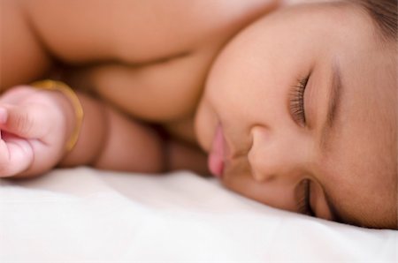 Adorable 6 months old Indian baby girl in deep sleep Stock Photo - Budget Royalty-Free & Subscription, Code: 400-06092799