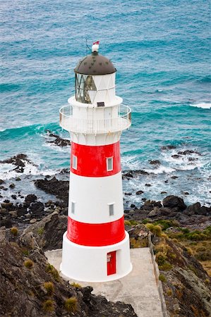 Beautiful lighthouse at Cape Palliser, North Island, New Zealand Foto de stock - Super Valor sin royalties y Suscripción, Código: 400-06093021