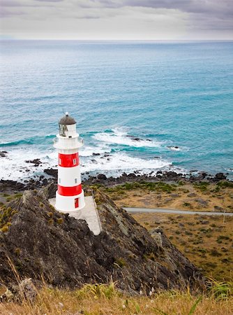 Beautiful lighthouse at Cape Palliser, North Island, New Zealand Foto de stock - Super Valor sin royalties y Suscripción, Código: 400-06093022