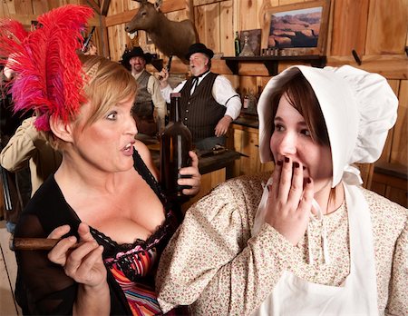 simsearch:400-06104096,k - Two ladies gossiping in an American old west tavern Stock Photo - Budget Royalty-Free & Subscription, Code: 400-06104098