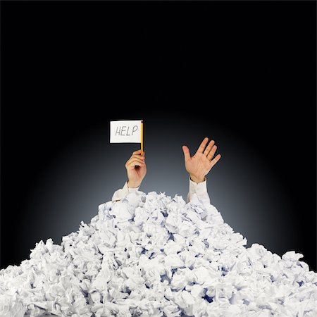 Person under crumpled pile of papers with hand holding a help sign Stock Photo - Budget Royalty-Free & Subscription, Code: 400-06104181