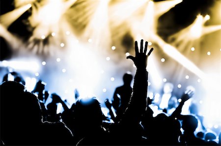 simsearch:6116-07236256,k - crowd cheering at a live music concert Stock Photo - Budget Royalty-Free & Subscription, Code: 400-06104598