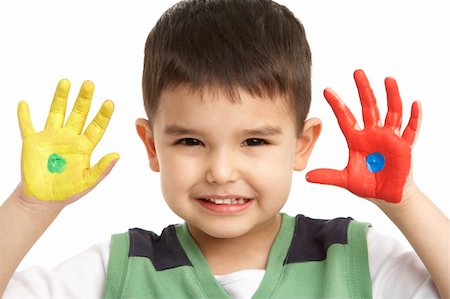 Studio Portrait Of Young Boy With Painted Hands Stock Photo - Budget Royalty-Free & Subscription, Code: 400-06104988