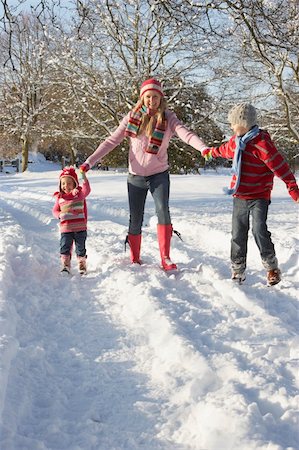 Mother Walking With Children Through Snowy Landscape Stock Photo - Budget Royalty-Free & Subscription, Code: 400-06107479