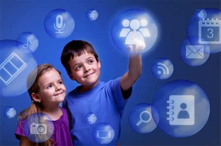 Kids accessing cloud computing applications on virtual three dimensional display Stock Photo - Budget Royalty-Free & Subscription, Code: 400-06107919