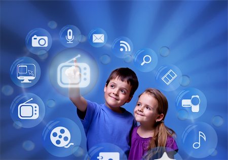 Kids accessing futuristic entertainment applications from the cloud computing interface Stock Photo - Budget Royalty-Free & Subscription, Code: 400-06108153