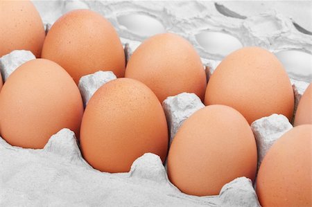 dozen - Closeup of many fresh brown eggs in carton tray Stock Photo - Budget Royalty-Free & Subscription, Code: 400-06108491