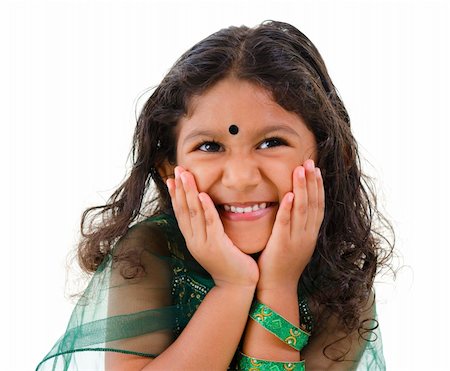 simsearch:400-06389659,k - Young little Asian Indian girl smiling on white background Foto de stock - Super Valor sin royalties y Suscripción, Código: 400-06108514