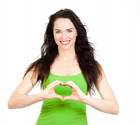 Beautiful young woman symboling a love heart with hands. Isolated over white. Foto de stock - Super Valor sin royalties y Suscripción, Código: 400-06108674