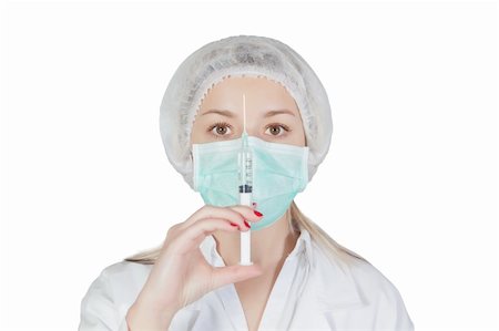 Pretty nurse with an injection and uniform. Isolated. Stock Photo - Budget Royalty-Free & Subscription, Code: 400-06100714