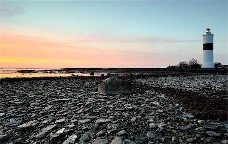 simsearch:400-04272525,k - lighthouse late at night after sunset with rocks in the foreground Stock Photo - Budget Royalty-Free & Subscription, Code: 400-06101269