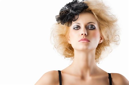 hair style with black accessory of a very beautiful blond girl wearing a black bra lingerie, she is in front of the camera and looks in to the lens with serious expression Stock Photo - Budget Royalty-Free & Subscription, Code: 400-06102733