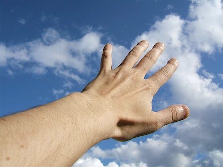 evangelist - Human hand against a cloudy blue sky Stock Photo - Budget Royalty-Free & Subscription, Code: 400-06126408