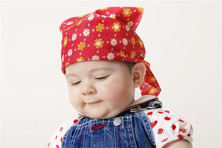 shy baby - Little girl looking downwards. Stock Photo - Budget Royalty-Free & Subscription, Code: 400-06128883