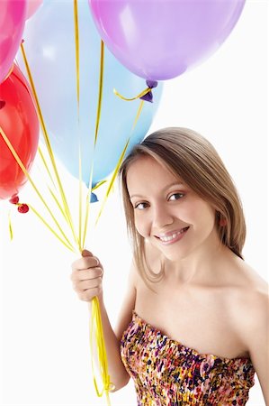 A young girl holding balloons Stock Photo - Budget Royalty-Free & Subscription, Code: 400-06135691