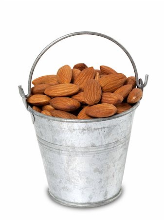 simsearch:400-04833195,k - Tin bucket with almonds. Isolated on white background. Stock Photo - Budget Royalty-Free & Subscription, Code: 400-06135761