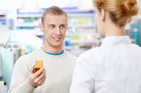 A young man at the pharmacy Stock Photo - Budget Royalty-Free & Subscription, Code: 400-06135928