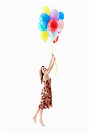 Young girl with balloons on a white background Stock Photo - Budget Royalty-Free & Subscription, Code: 400-06136003