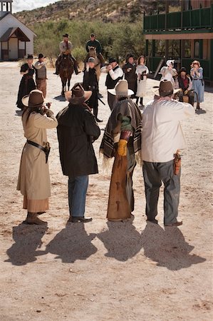 Dangerous gunfight outside in old American west scene Stock Photo - Budget Royalty-Free & Subscription, Code: 400-06136043