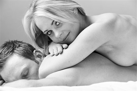 Young and fit caucasian adult couple lying on naked on a bed. Black and White. Stock Photo - Budget Royalty-Free & Subscription, Code: 400-06137153