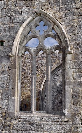 simsearch:400-05732778,k - Ruins of Kilmacduagh Monastery, County Galway, Ireland. Window Stock Photo - Budget Royalty-Free & Subscription, Code: 400-06137748