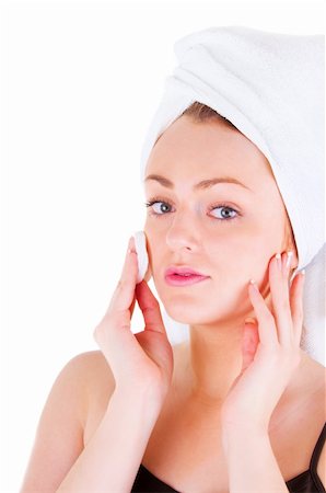 simsearch:400-06137898,k - Young woman with white towel on hair is cleaning her face. Foto de stock - Super Valor sin royalties y Suscripción, Código: 400-06137893
