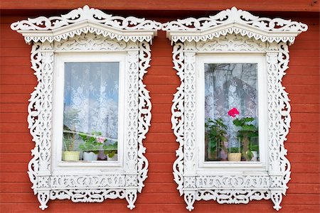 simsearch:400-07054392,k - Two traditional Russian wooden window with flowers on windowsills Photographie de stock - Aubaine LD & Abonnement, Code: 400-06138033