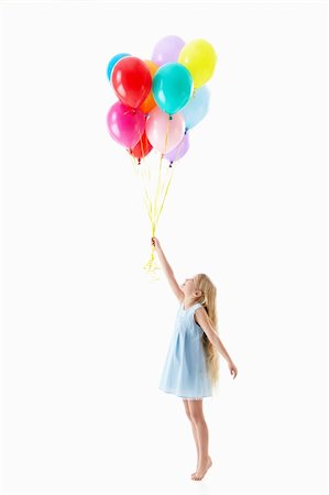 Little girl with balloons on a white background Stock Photo - Budget Royalty-Free & Subscription, Code: 400-06138174