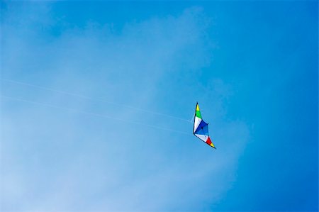 sports events - colorful kite soaring in a nice blue sky Photographie de stock - Aubaine LD & Abonnement, Code: 400-06138394