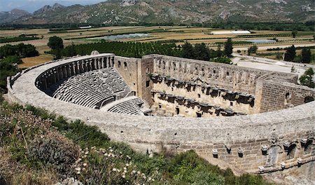 simsearch:400-06642892,k - Open old circle theater Aspendos in Antalya, archeology background. Constructed by Greece architect Eenon during time of Mark Aurelius Stock Photo - Budget Royalty-Free & Subscription, Code: 400-06139677