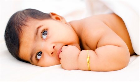 Six months old Indian baby girl sucking her fingers Stock Photo - Budget Royalty-Free & Subscription, Code: 400-06139713