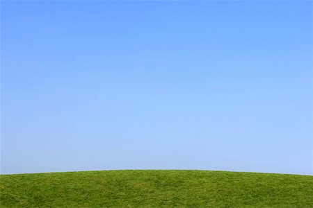 peace backdrop - Grass hillside with a clear blue sky. Foto de stock - Super Valor sin royalties y Suscripción, Código: 400-06130957