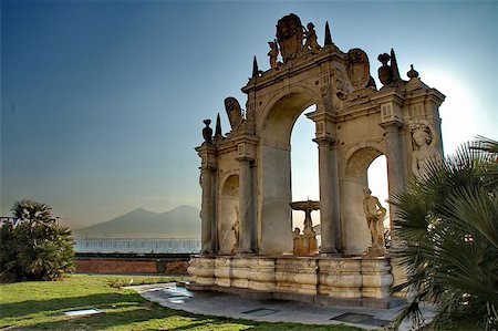 Fountain called " Fontana del Gigante" or "Fontana dell'Immacolatella" Made around the turn of the century. Designed by Bernini. The Vesuvio volcano in the background. Stock Photo - Budget Royalty-Free & Subscription, Code: 400-06131179